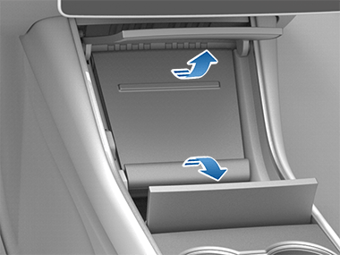 Image with arrows showing to open both center console doors.